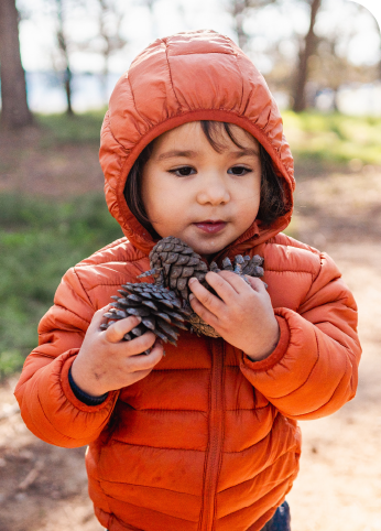 child in orange coat